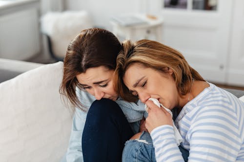 Photograph of Women Crying Together