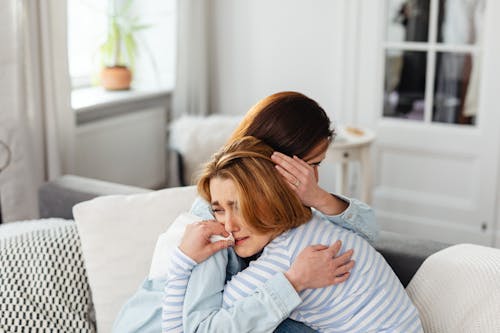 Free Photo of a Woman Hugging a Crying Woman Stock Photo