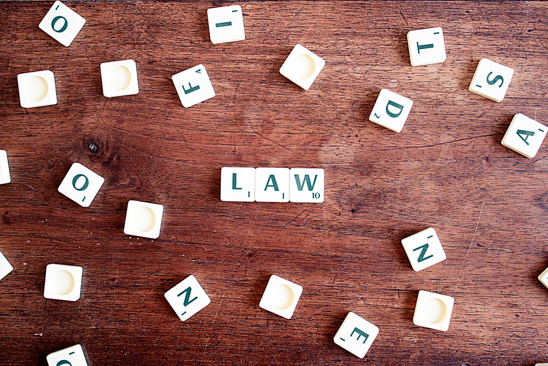 Scrabble tiles forming the word ‘law’