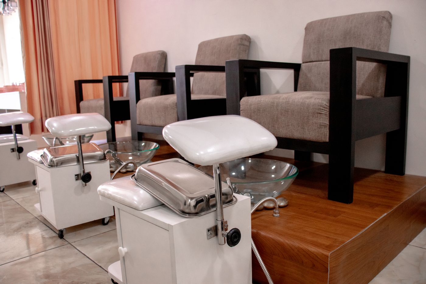 Organised pedicure salon chairs with dedicated foot-spa basins