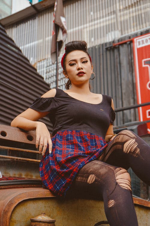 Trendy Asian model in ripped tights in town · Free Stock Photo