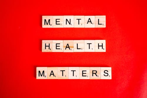 Mental Health Matters Spelled on Letter Tiles on Red Background