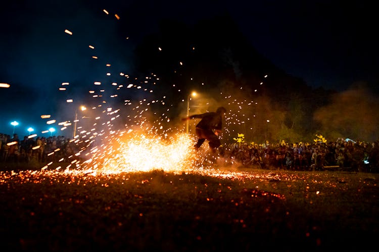 Man Jumping Over Burning Fire