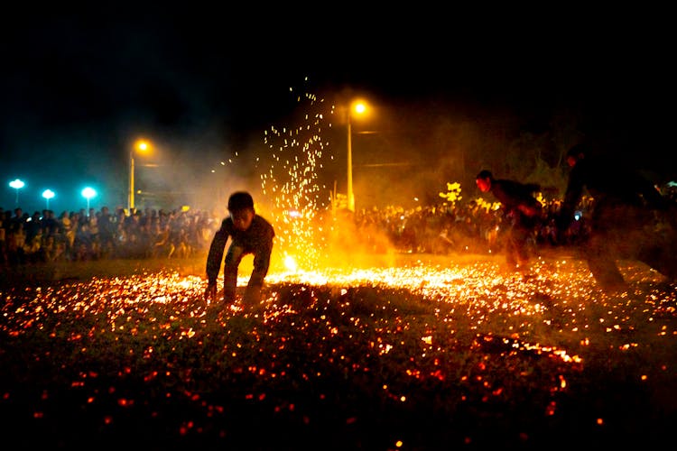 Kids Jumping On Burning Sparks At Night