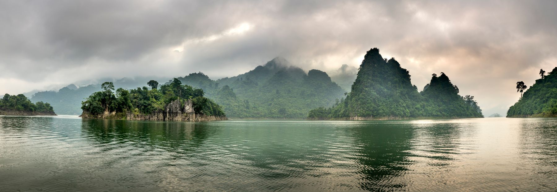 Limestone islands on a misty lake, by Quang Nguyen Vinh on Pexels
