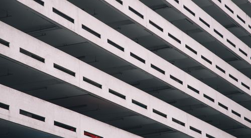 Free Contemporary multi-level parking structure with geometric design in urban setting. Stock Photo