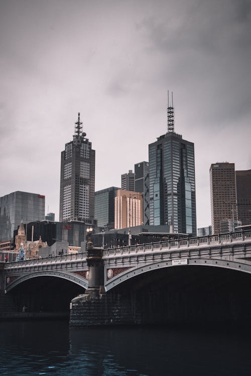 Gray Concrete Bridge over City Buildings