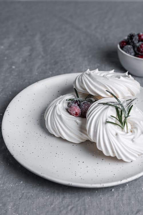 White Meringues on a Ceramic Plate 