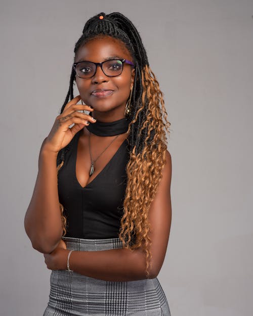 A Woman With Dreadlocks Wearing a Black Top 