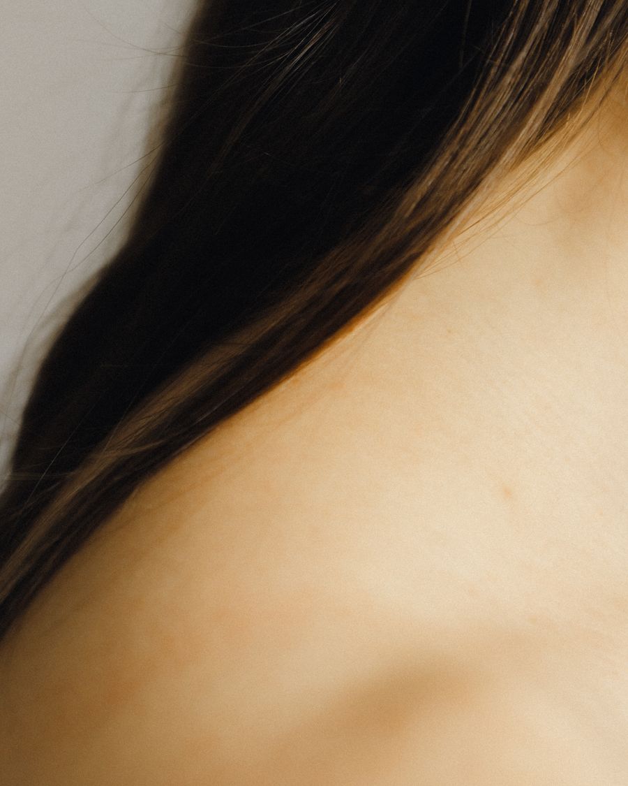 Close-up of clear, even-toned skin on the shoulder and neck