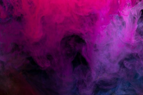 Free A mesmerizing blend of pink and purple smoke creating a vivid abstract background with flowing patterns. Stock Photo