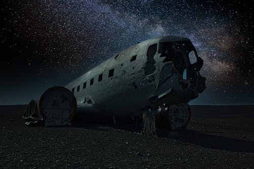 A Wrecked Airplane Under the Starry Sky