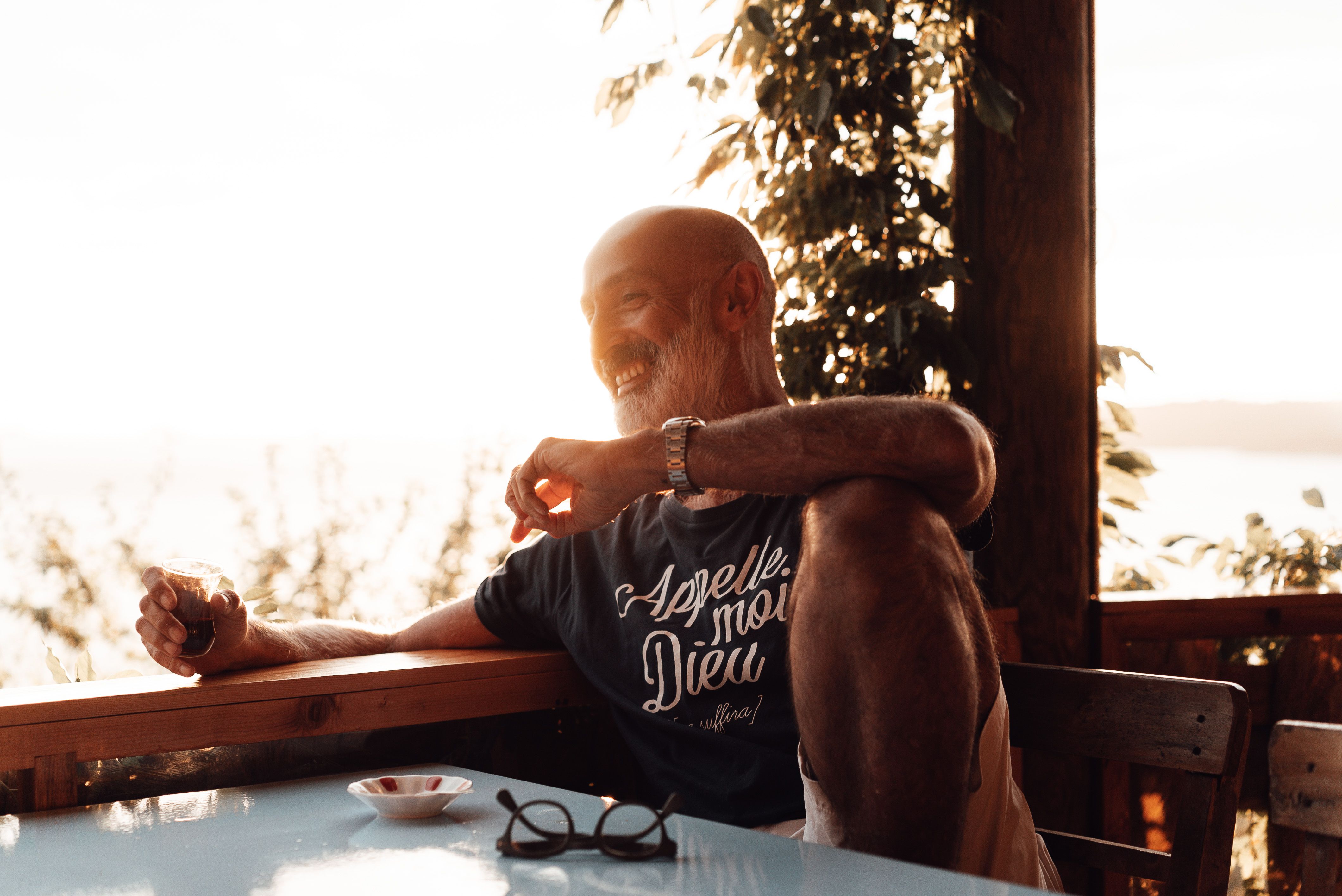 A relaxed older man at home after deciding on his colon cancer screening plan