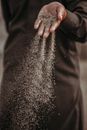 Sand Slipping Through Fingers