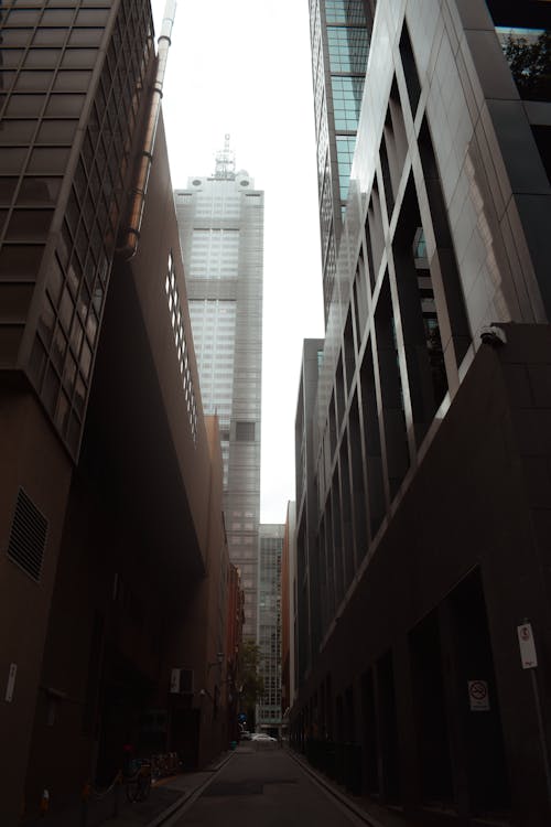Free Narrow Alley Between Tall Buildings Stock Photo