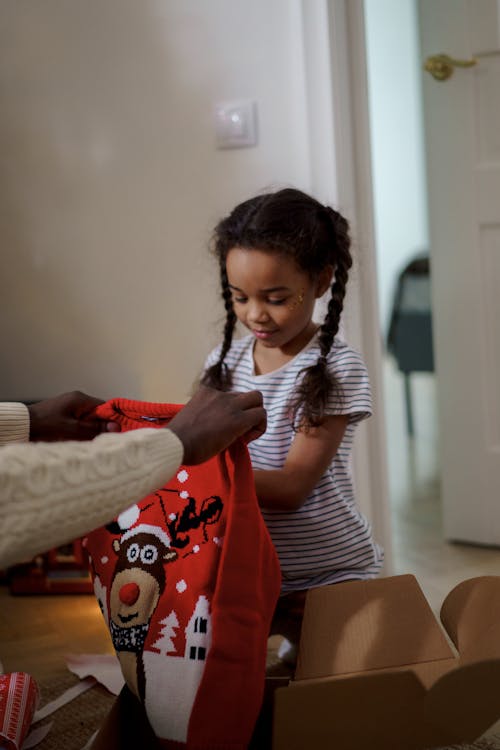 A Girl Unboxing Christmas Presents