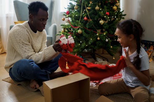 Free Dad and Daughter Unboxing a Christmas Present Stock Photo