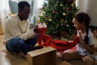 Dad and Daughter Unboxing a Christmas Present