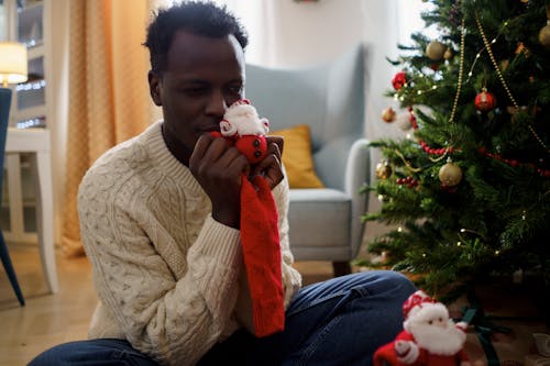 Dad Holding a Red Christmas Socks