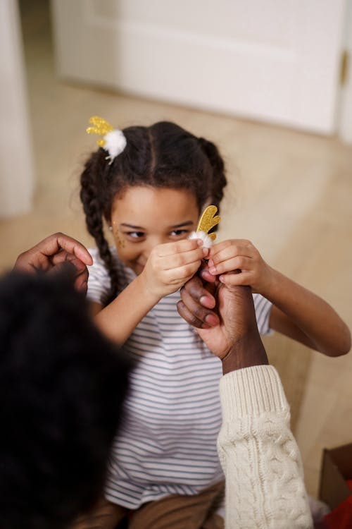 A Girl Smiling While Holding Her Antler Hair Pin