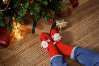 Person Wearing Red Christmas Socks