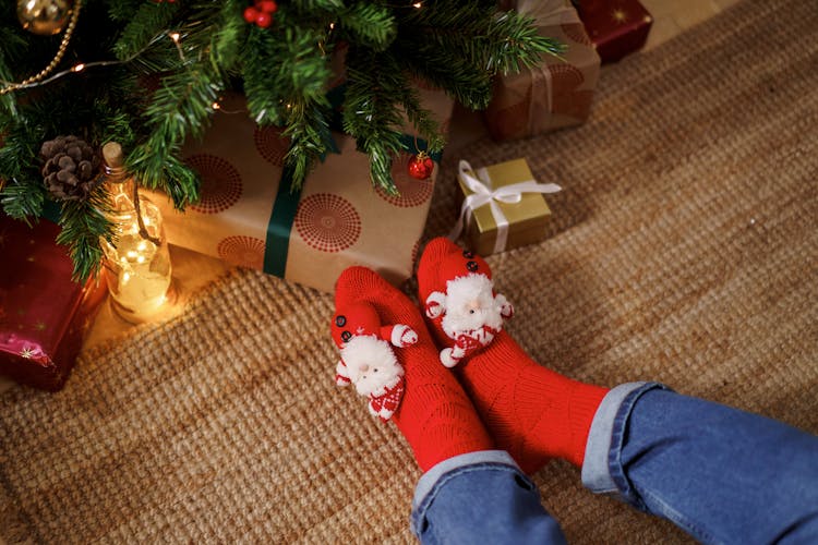 Person Wearing Red Christmas Socks