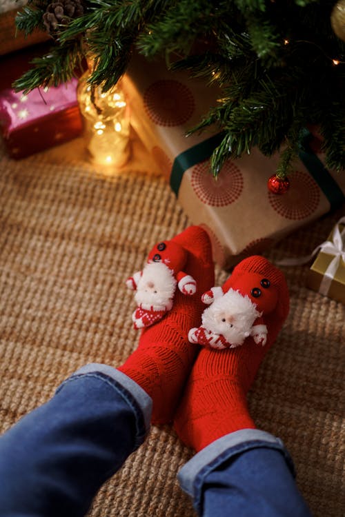 Person Wearing Red Christmas Socks