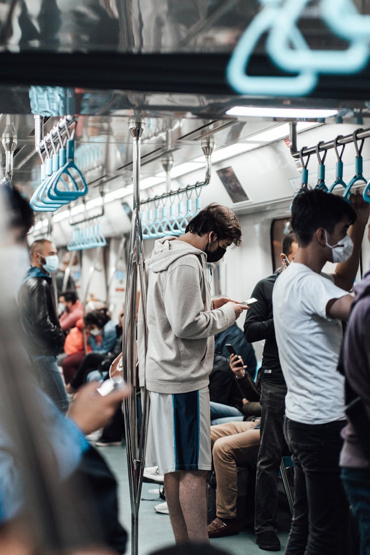 Crowded Metro Train With Passengers In Masks