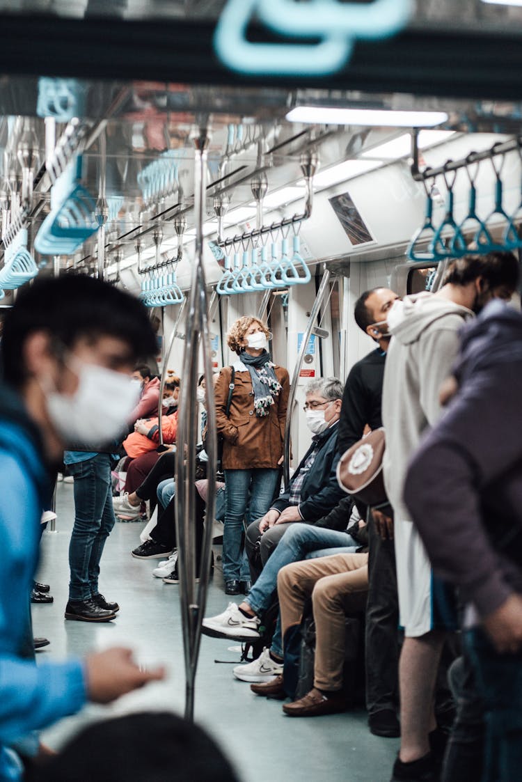 Anonymous People In Masks Riding Train During COVID 19