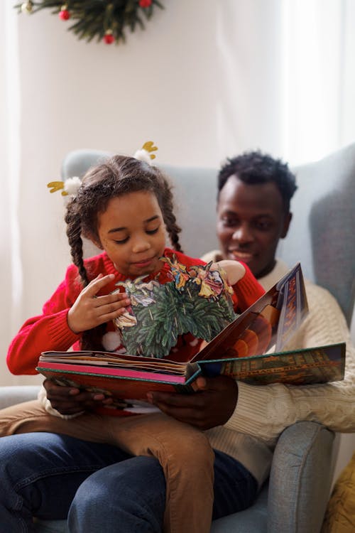 Dad and Daughter Reading a Cutouts Fairy Tale Book