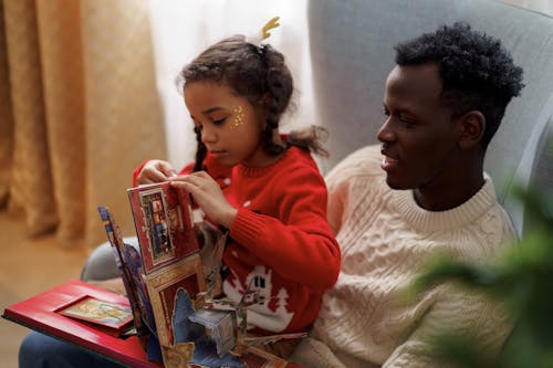 Dad and Daughter Reading a Cutouts Fairy Tale Book