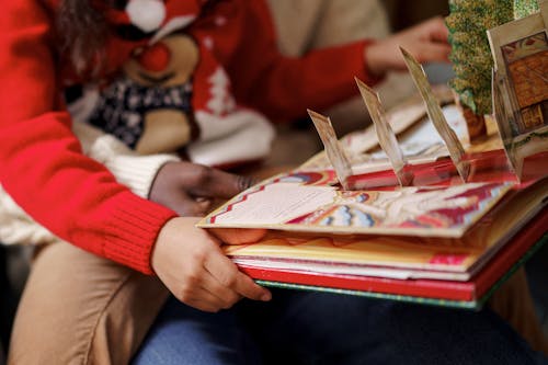 Two Persons Reading a Cutouts Fairy Tale Book