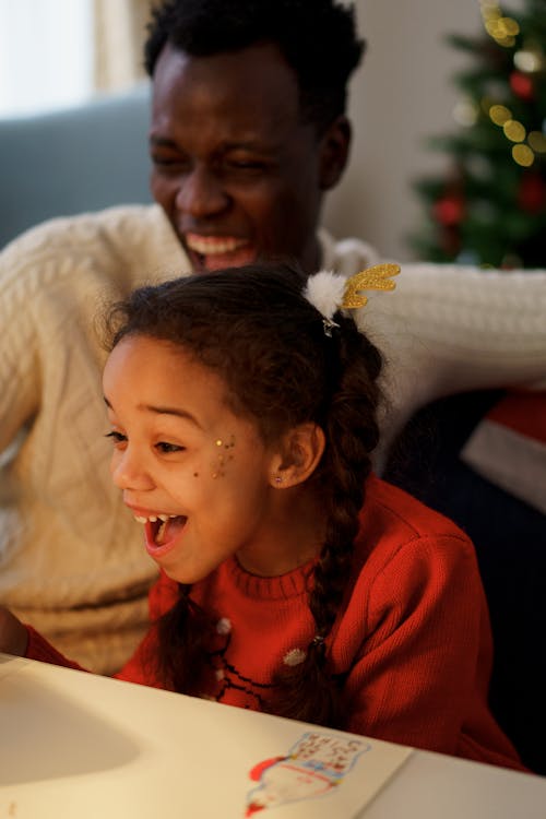 A Dad and Daughter Laughing