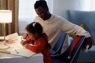 Dad Watching Her Daughter Make a Christmas Letter