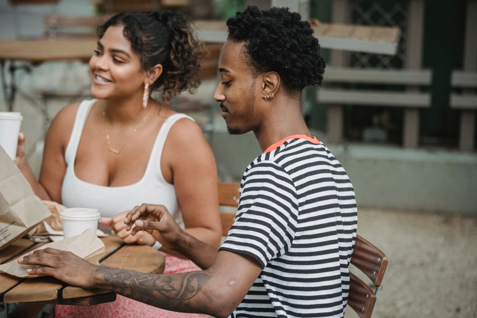 Two adults sharing a warm conversation over coffee