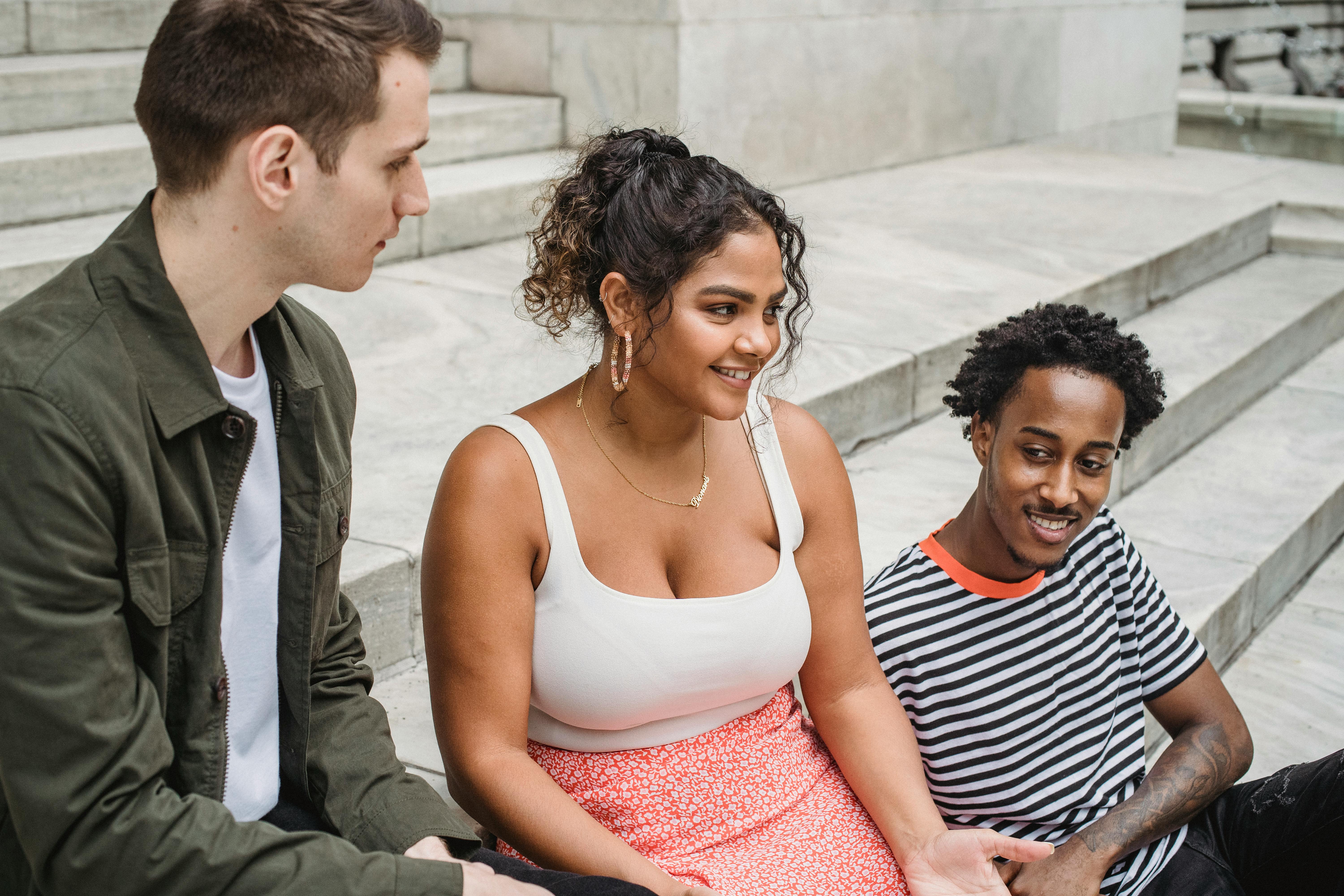 happy diverse friends communicating on stars on street