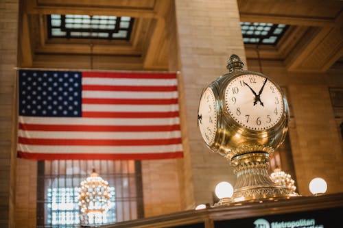 Vintage clock against American flag