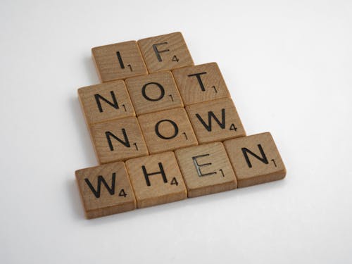 Close-Up Photo of Wood Scrabble Letter Tiles