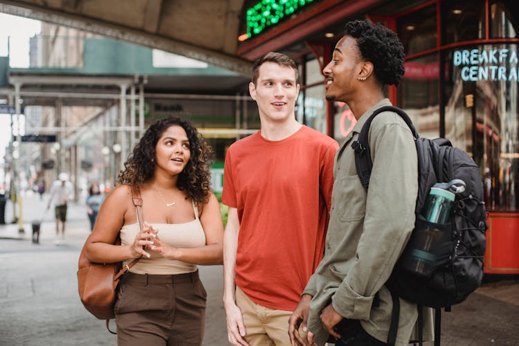 Cheerful Multiethnic Friends Chatting On Street