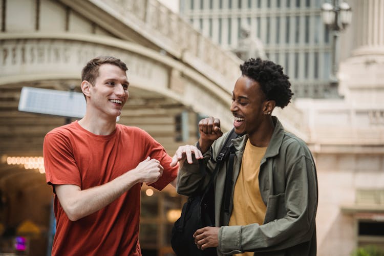 Cheerful Multiethnic Men Having Fun On Street