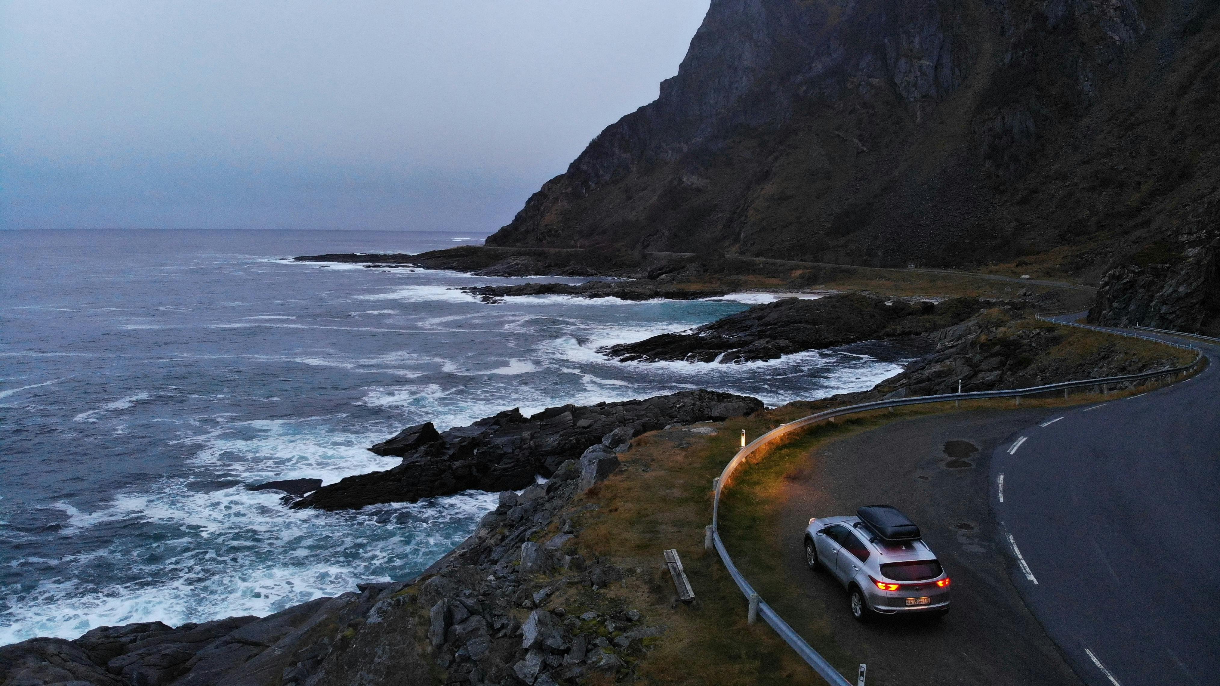 YouTuber planning content with AI tools on a laptop and notebook