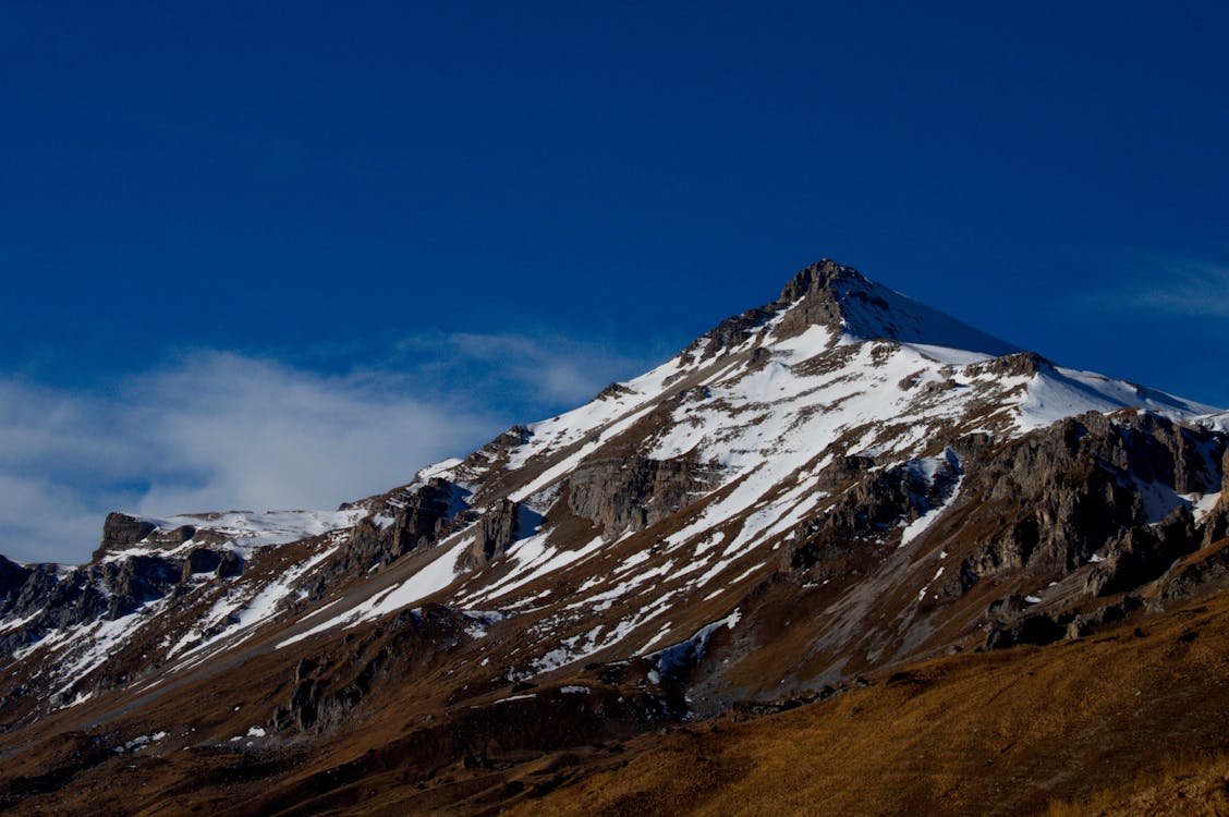 Snow Covered Mountain Peak During Winter