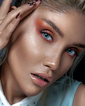 Detailed portrait showcasing vibrant eye makeup and striking blue eyes for a fashion-forward look.