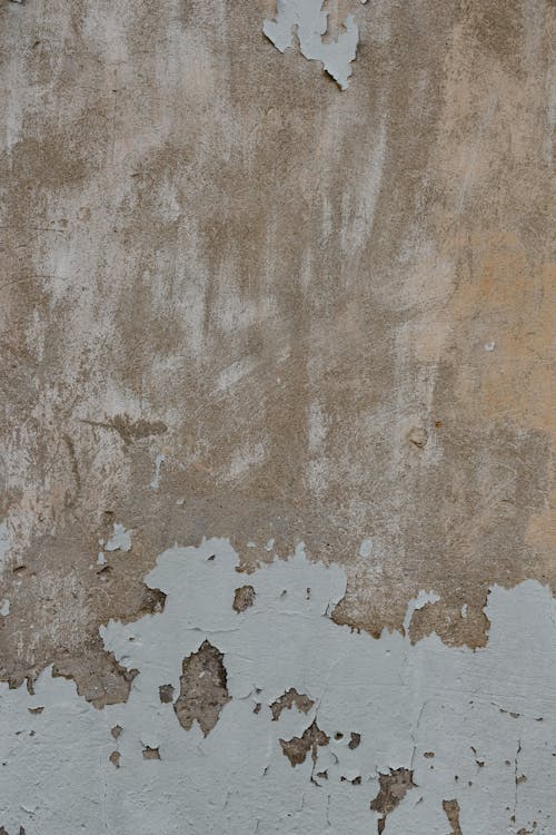A Brown Concrete Wall with Peeling Paint