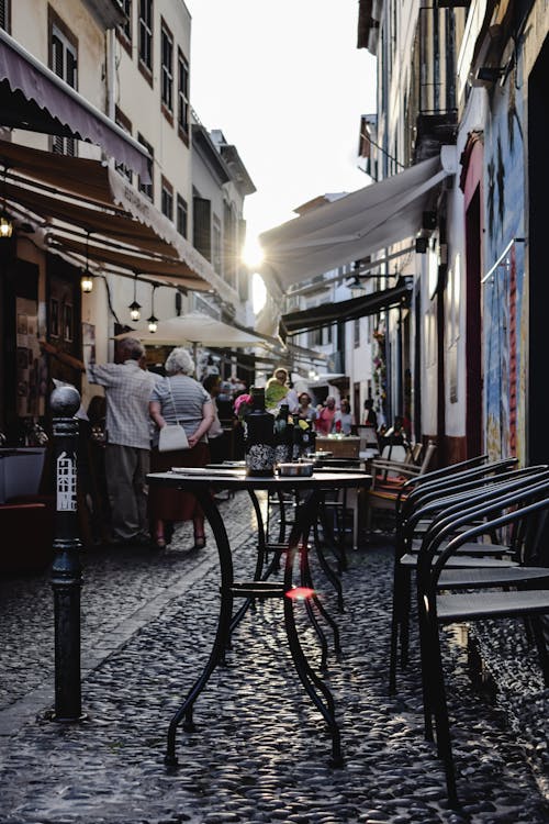 Free Tables and Chairs on an Alley Stock Photo