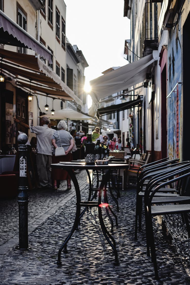 Tables And Chairs On An Alley