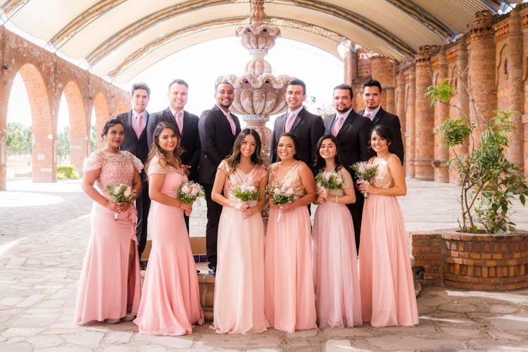 Portrait Of Bridesmaids And Groomsmen At Wedding