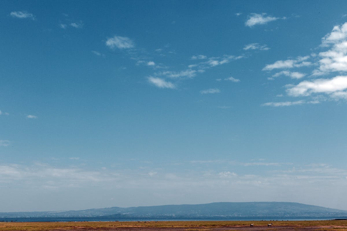 Stormy sky over rolling hills suggesting emotional turmoil
