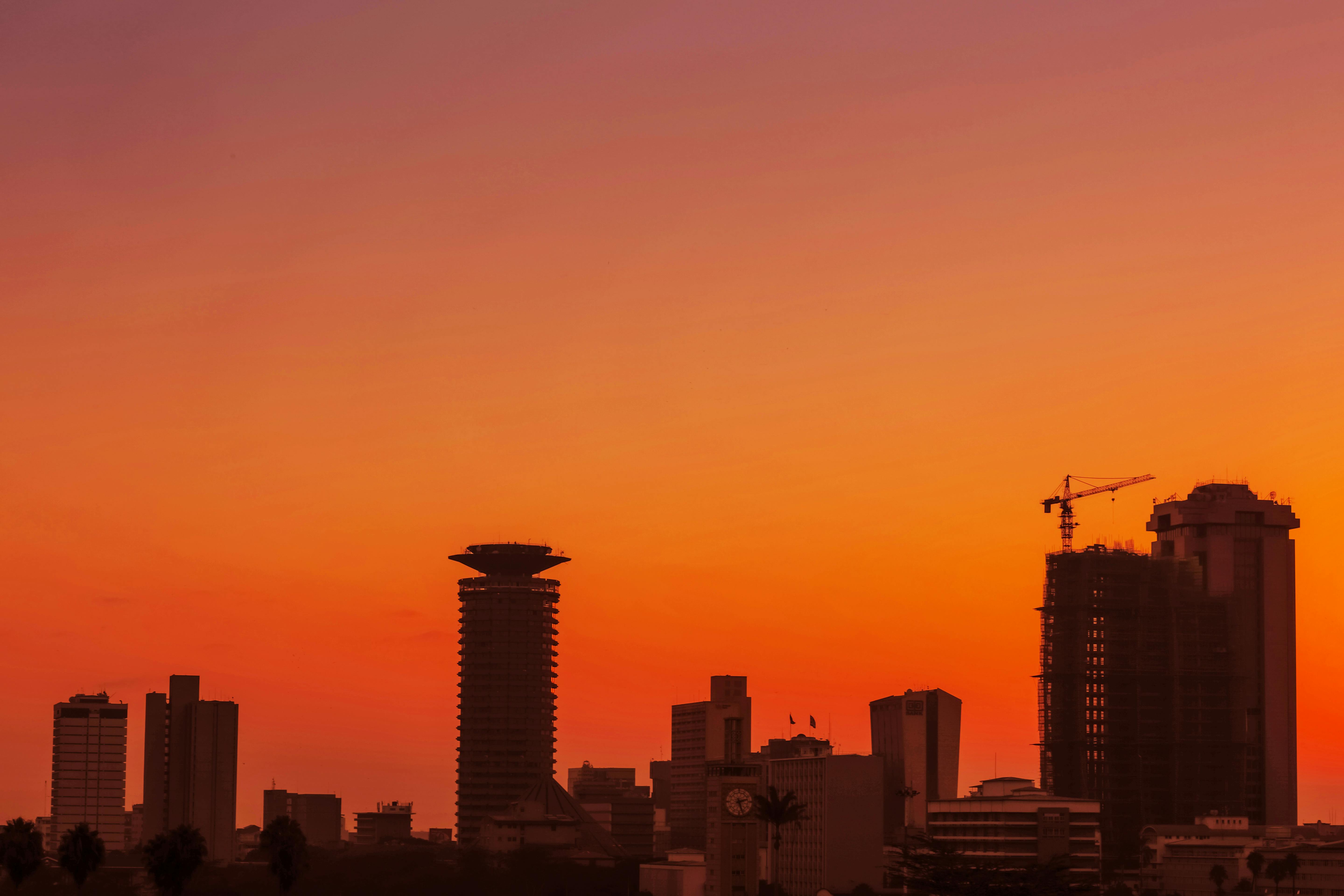 Spiral Lights on Sky over Tower Building at Dusk · Free Stock Photo