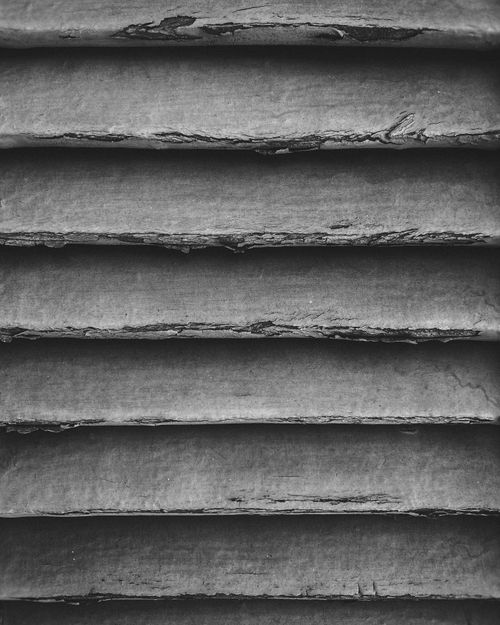 Free Close-up of a textured concrete surface with an abstract pattern in black and white. Stock Photo